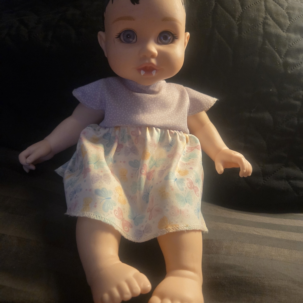 FAO Schwarz Baby Doll with Purple and Pastel Dress